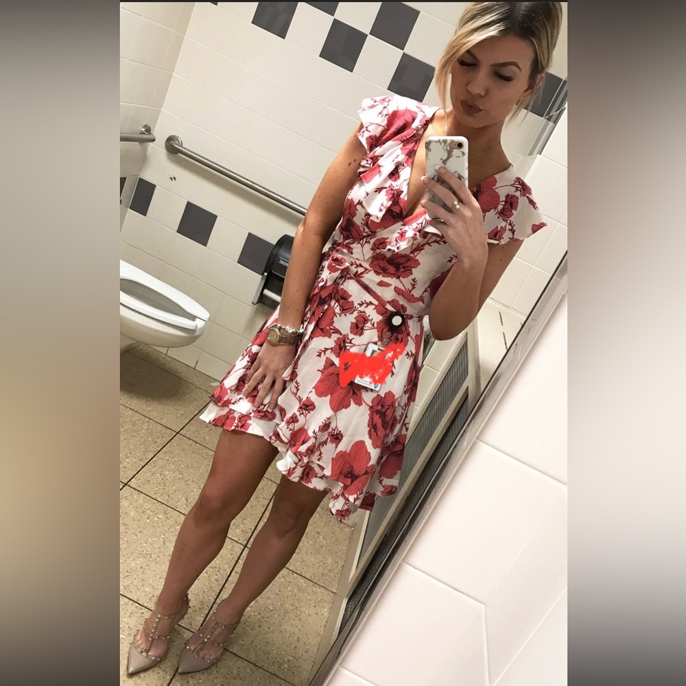 Flowery dress above knee length.